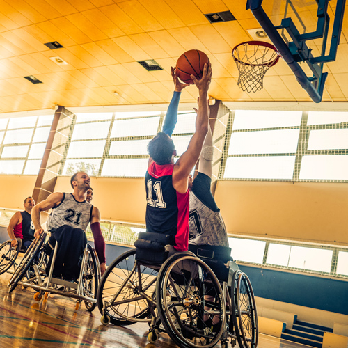 Men's team playing wheelchair basketball