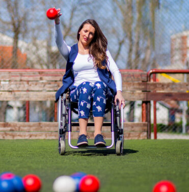 Woman playing wheelchair boccia